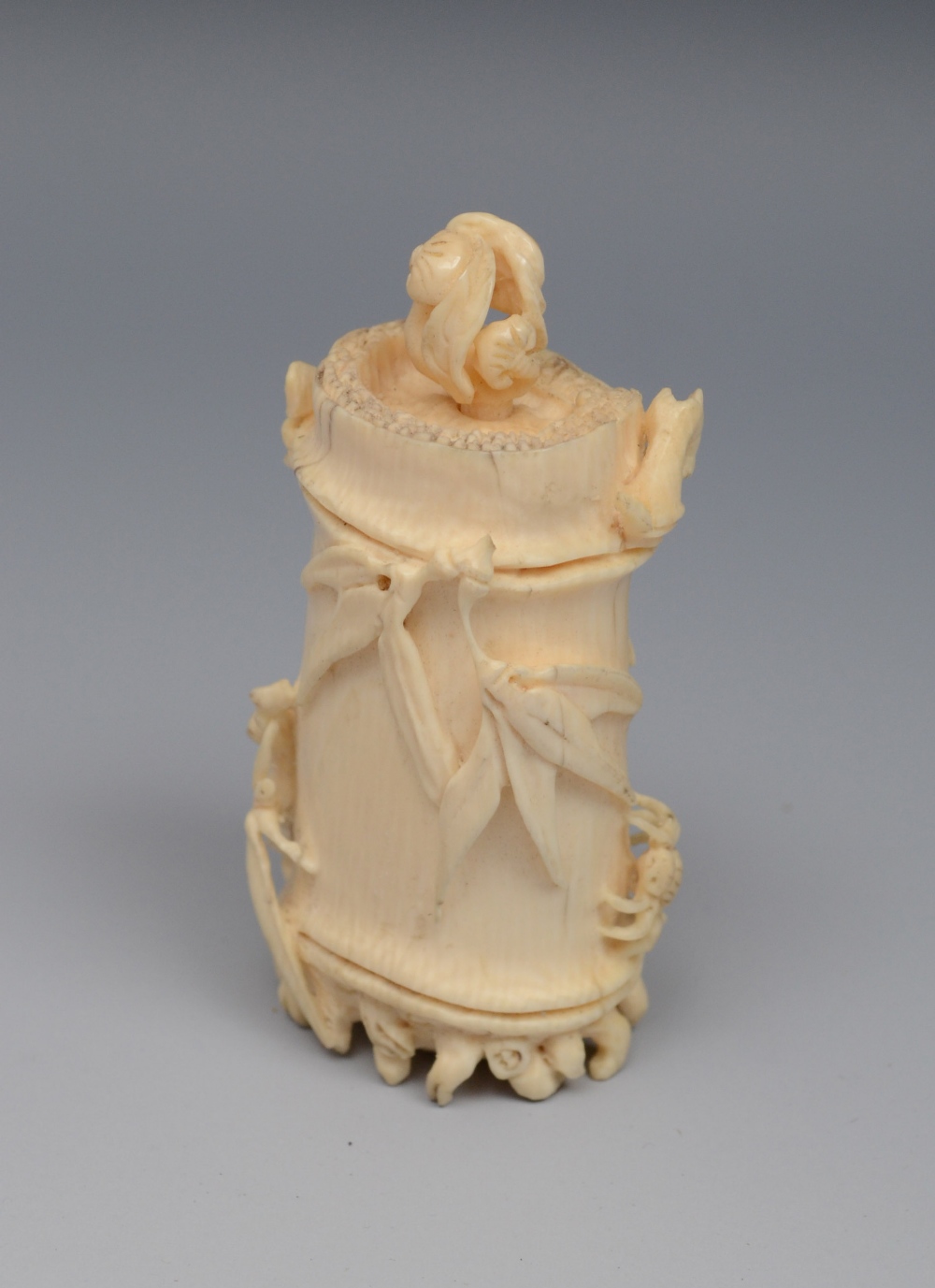 A Chinese ivory scent bottle, carved in relief as leafy bamboo, 5.5cm long, early 20th century