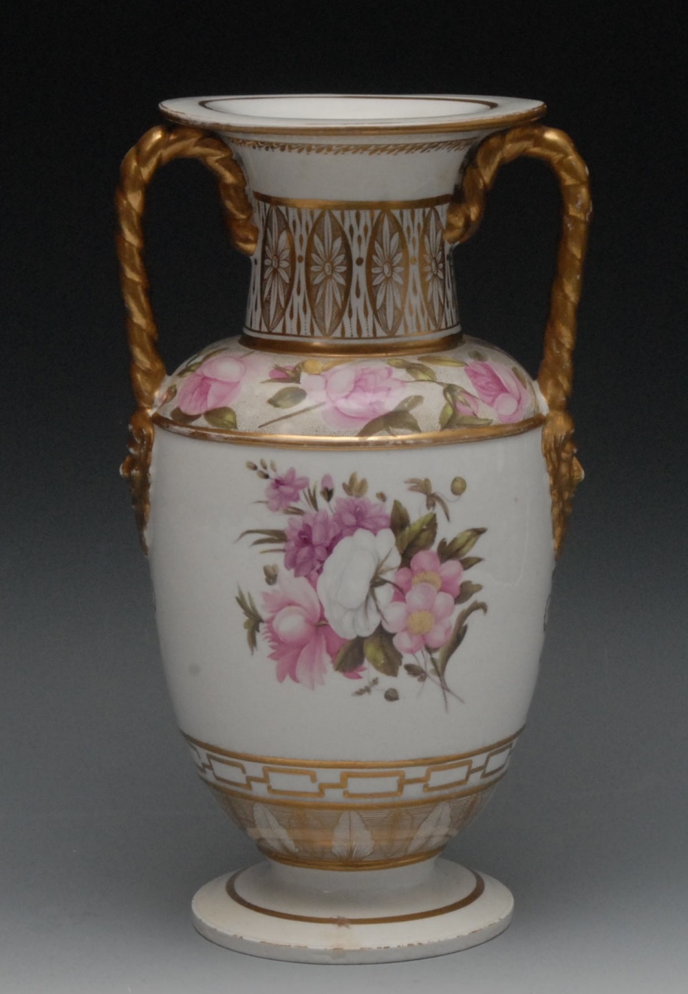 An English porcelain two-handled pedestal ovoid vases, well painted with bouquet of colourful