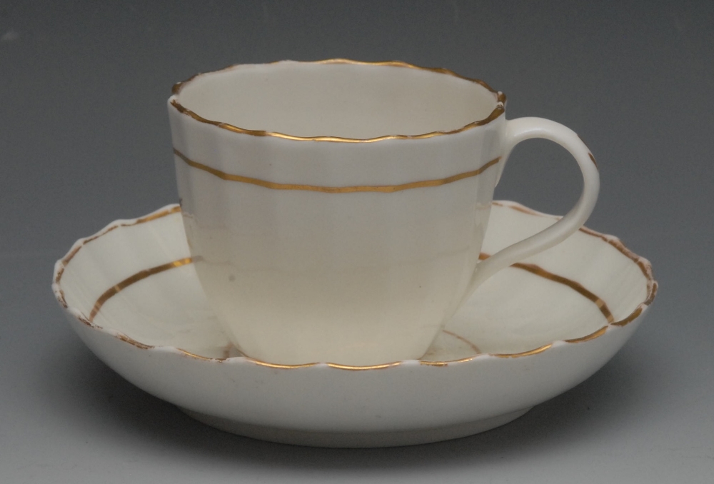 Rev Wilmot Service - a Pinxton fluted Bute teacup and saucer, decorated with gilt star, gilt line