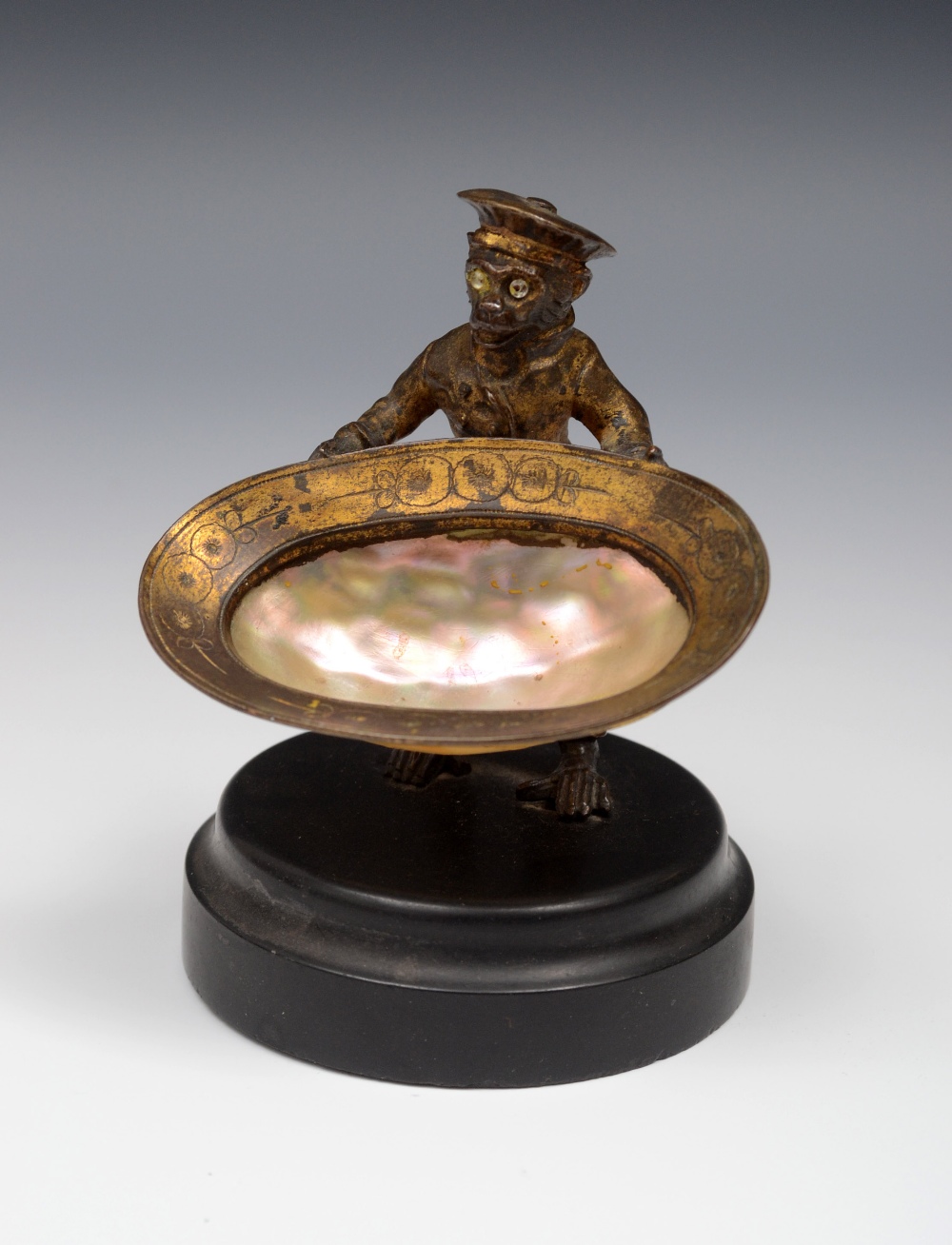 A 19th century French gilt bronze novelty salt or sweetmeat dish, as a monkey holding a large