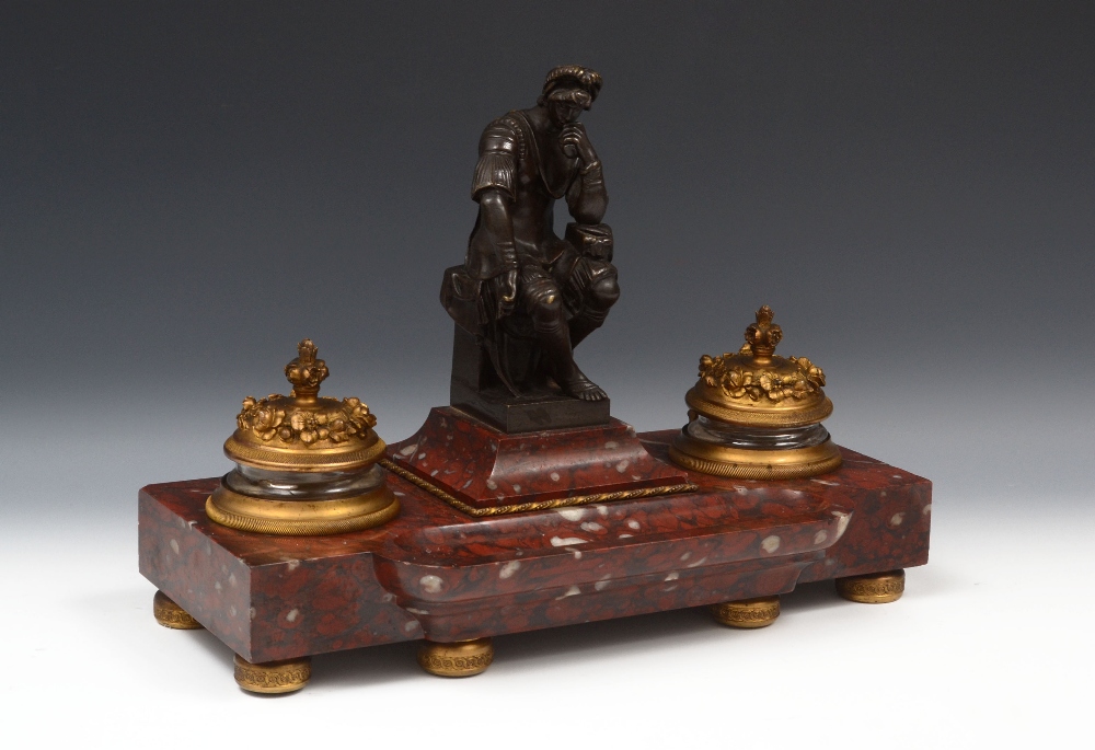 A 19th century French bronze, ormolu and griotte rouge marble desk stand, the clear glass wells