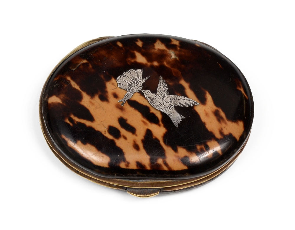 A 19th century tortoiseshell and silver pique oval purse, hinged cover inlaid with birds, 7cm wide,