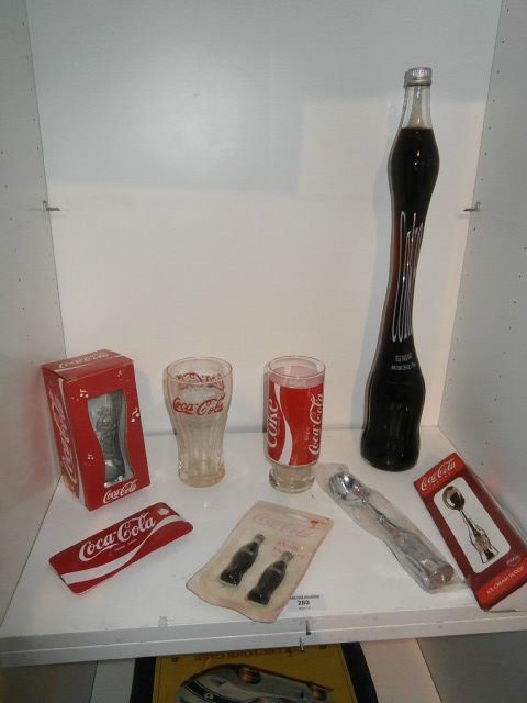 Shelf of Coca Cola memorabilia