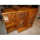 Carved tai bar folds away into a cabinet