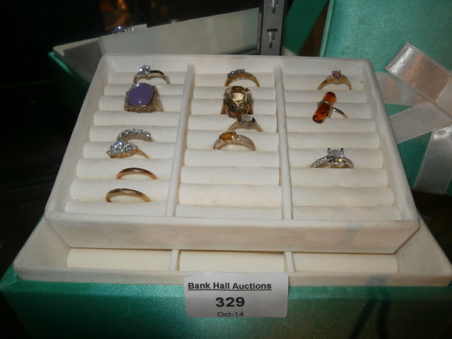 Ring box containing 13 gold and silver rings