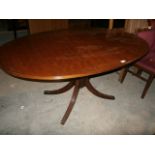 Single pedestal mahogany dining table