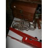 Regent trumpet in its case and a music stand