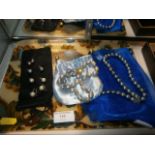 Tray of pearl necklaces and earrings