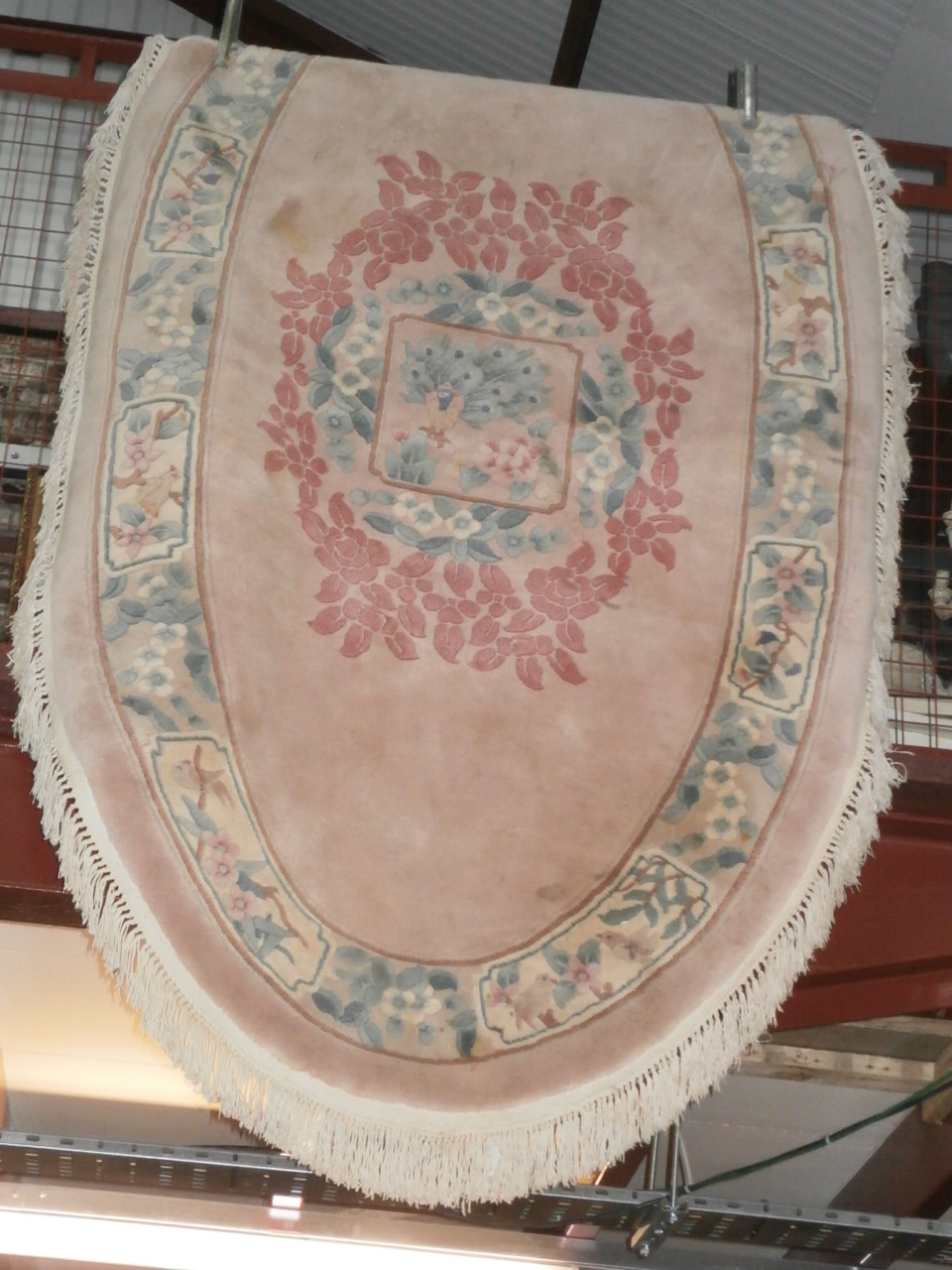 Pink patterned oval rug