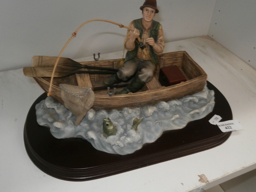 Fisherman in boat figurine