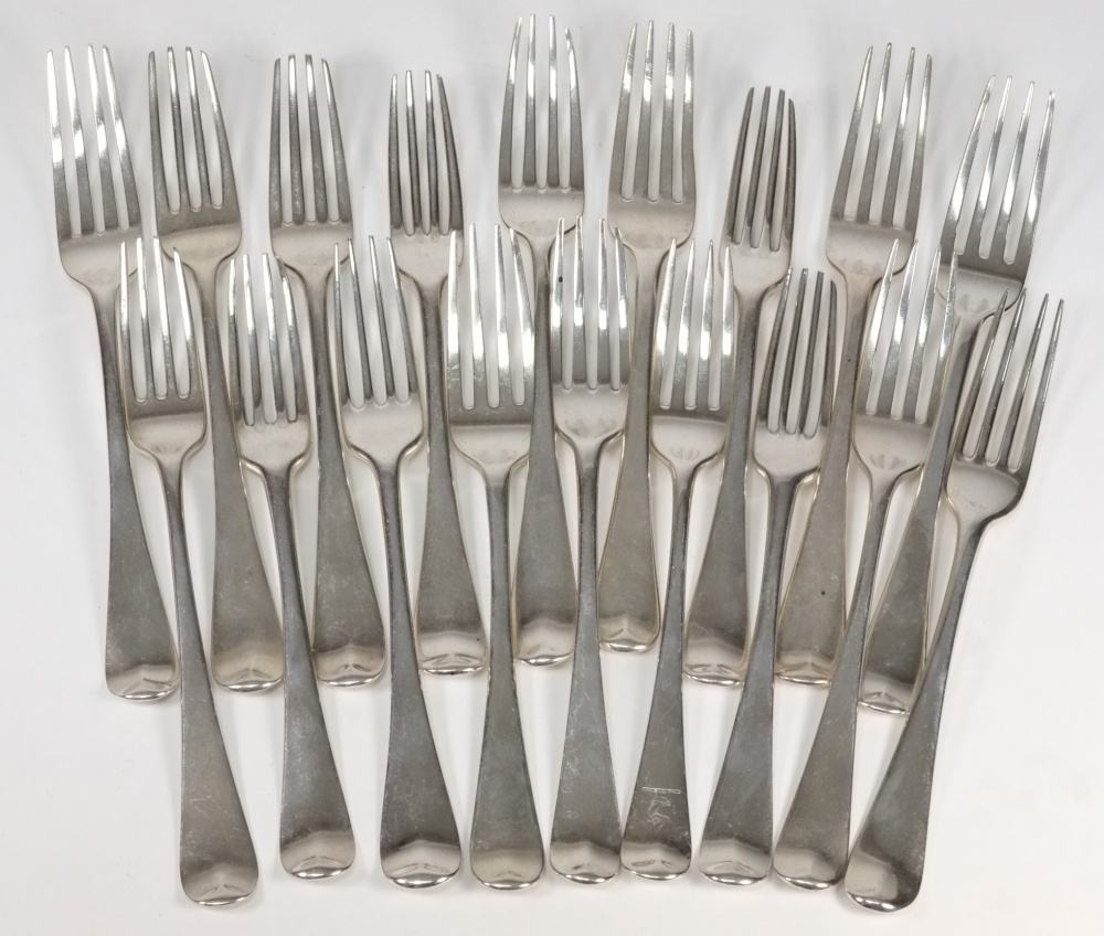 A collection of eighteen Georgian silver Old English pattern table forks: mostly crested or