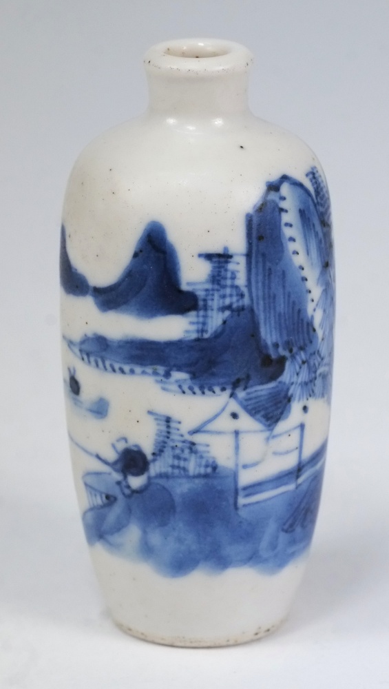 A Chinese porcelain snuff bottle: of oviform painted in blue with a fisherman in an extensive