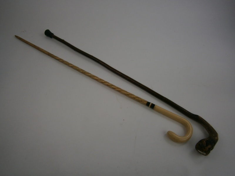 A whalebone walking cane together with a  hazel walking stick:, the whalebone cane with rope twist