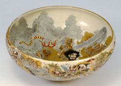 A Japanese Satsuma bowl: the interior and exterior decorated with deities and numerous figures from