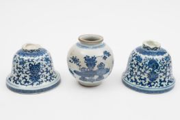 A Chinese blue and white jar and two altar vase/candlestick bases: the first item the lower section