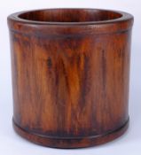 A  large Chinese hardwood brush pot: of cylindrical outline, 21.5cm. high.