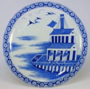 A large Japanese blue and white dish: painted with a large two storied ceremonial boat, swallows