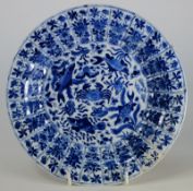 A Chinese blue and white dish: the centre painted with a crab surrounded by four fish including a