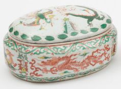 A Chinese wucai box and cover: of shaped oval form, painted with phoenix and dragons between bands