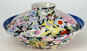 A Chinese millefleurs bowl and cover: painted in famille rose enamels on a black ground, the