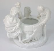 A German white porcelain group: in the form of a gallant and lady dancing around a wellhead, a duck