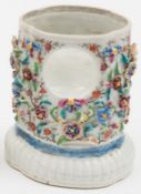 A Chinese famille rose export porcelain watch holder: the lobed oval body applied and painted with