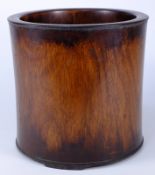 A  large Chinese hardwood brush pot: of cylindrical outline, 19cm. high.