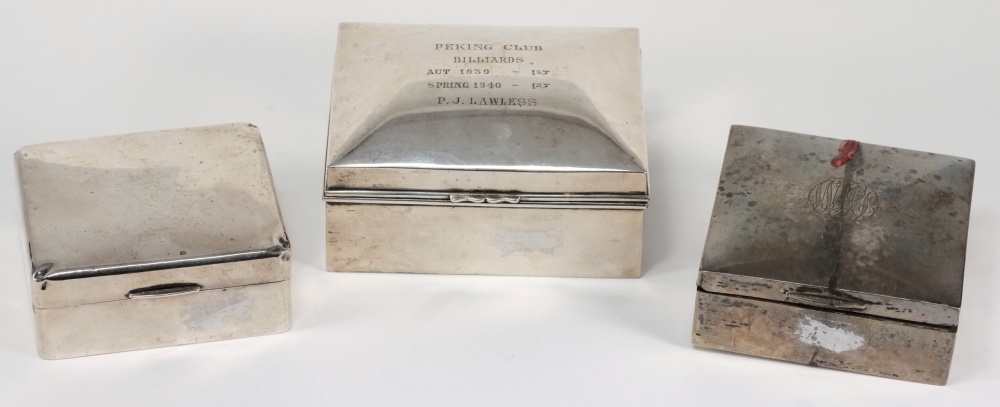 Two silver square cigarette boxes, wood lined, Birmingham 1939 and Birmingham 1922, also another,