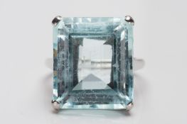 A rectangular aquamarine single stone ring: approximately 17.9mm long x 15.5mm wide, in four claw