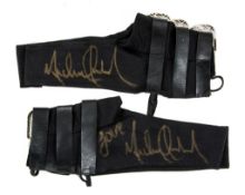 MEM A white arm brace and black shoe braces signed by Michael Jackson MEM A white arm brace and