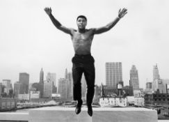 Thomas Hoepker  (b.1936) - Muhammad Ali, Formerly Cassius Clay, Jumping from a Bridge over the