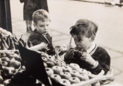 Bert Hardy (1913-1995) - Untitled (Child with Toffee Apple and Gun), ca.1950 Gelatin silver print,