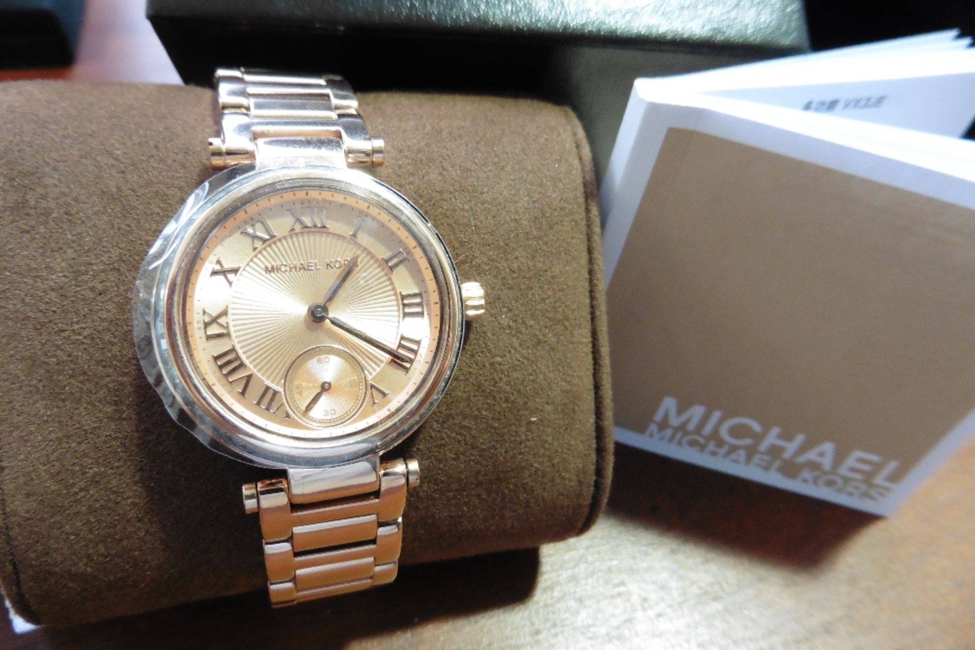 Stylish Michael Kors watch, model number MK5971, stainless steel with rose gold plating and stone