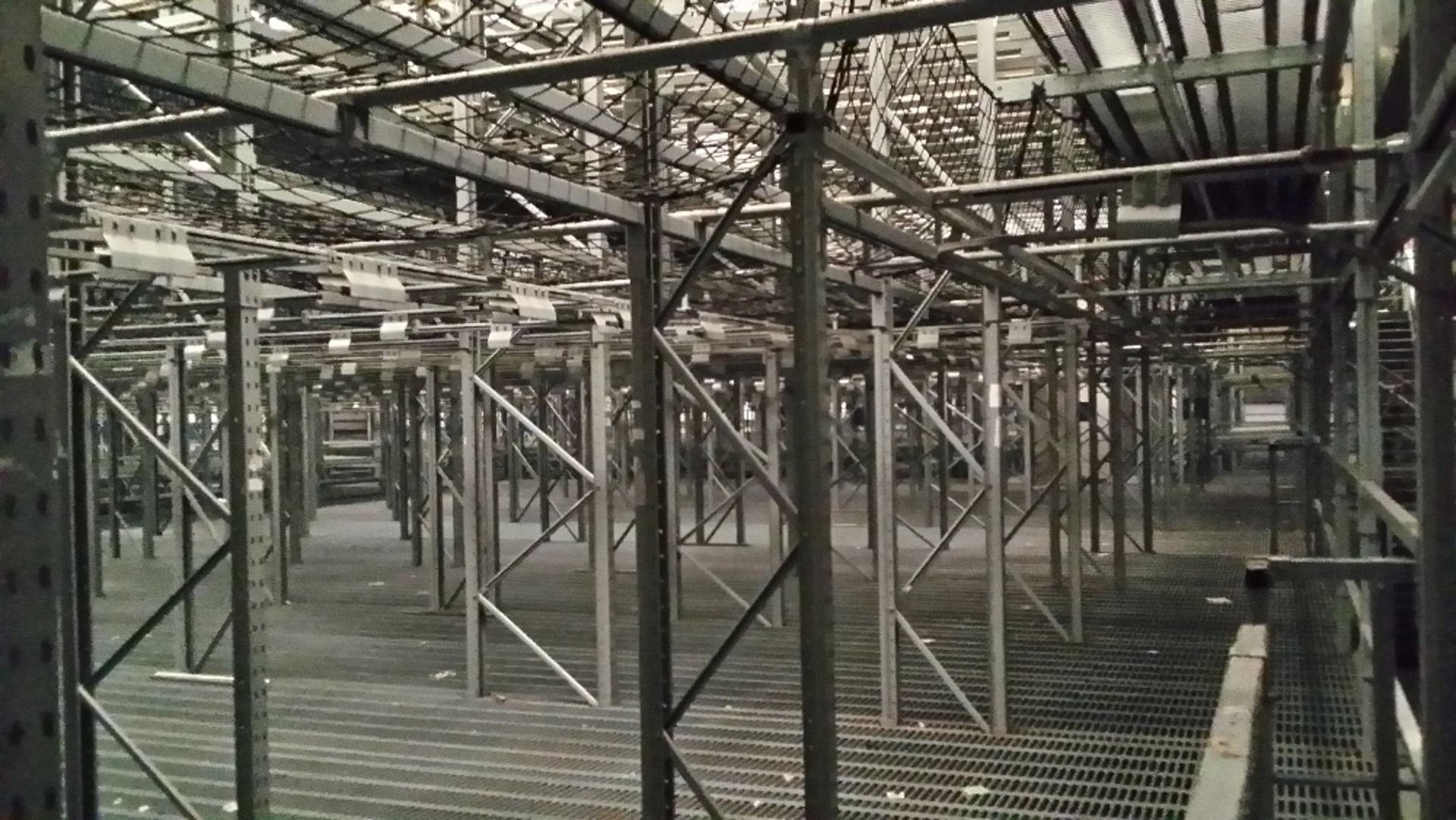 Bespoke 'hanging' Dexion racking system covering an area of approximatley 60m long x 30m wide and 8m - Image 4 of 4