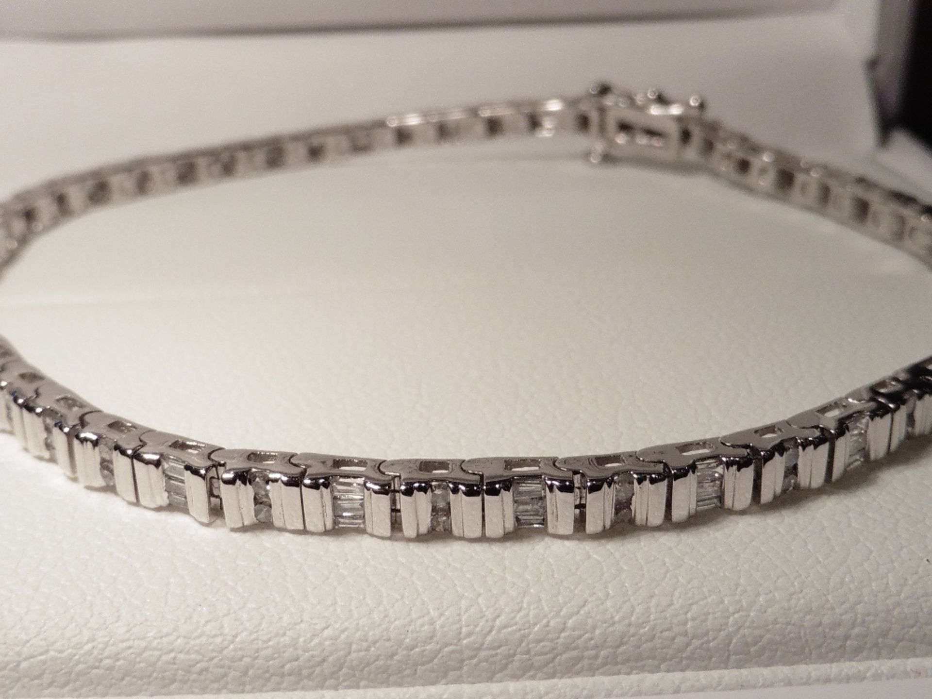 9ct white gold diamond bracelet set with small brilliant cut and baguette cut diamonds of H/I colour