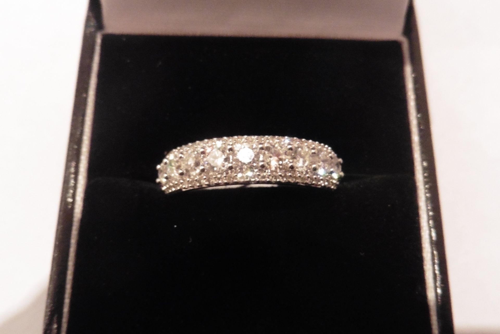 A stunning 14ct white gold diamond band ring, set with brilliant cut diamonds of P1 clarity and I co
