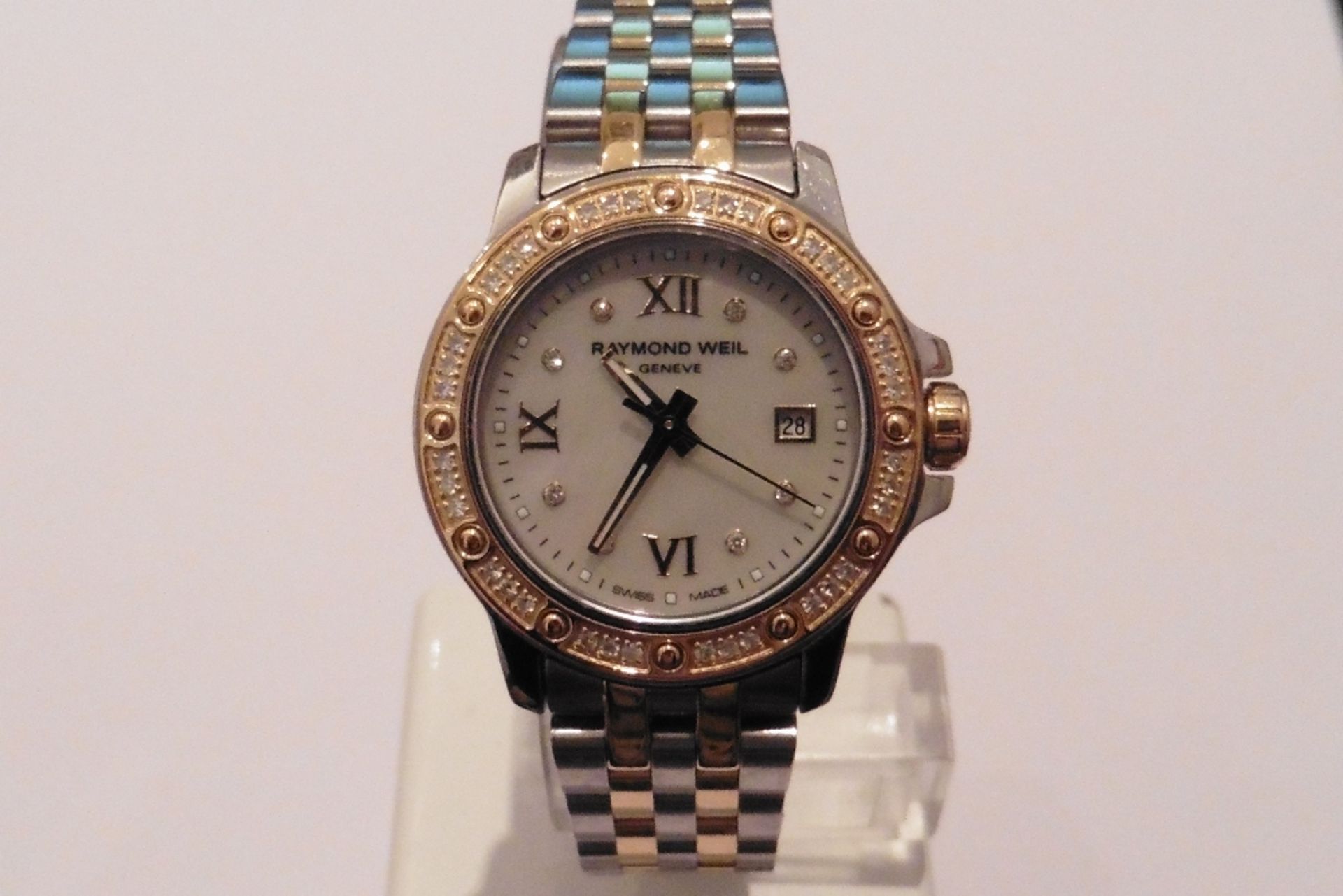 Pre-owned ladies Raymond Weil watch, model number 5399.  Stainless steel with gold plating. Has brac