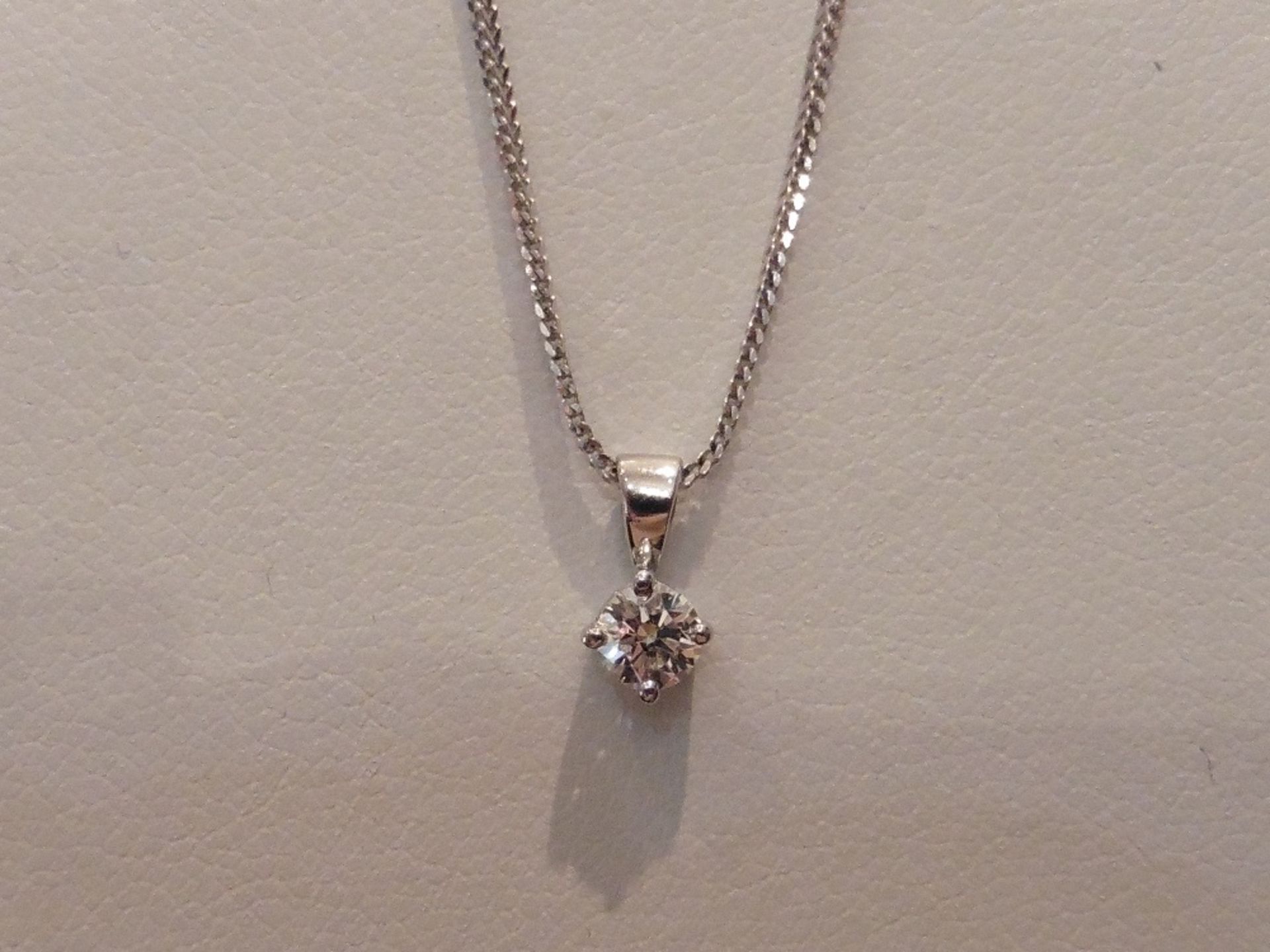 18ct white gold diamond solitaire style pendant set with a single brilliant cut diamond weighing 0.2