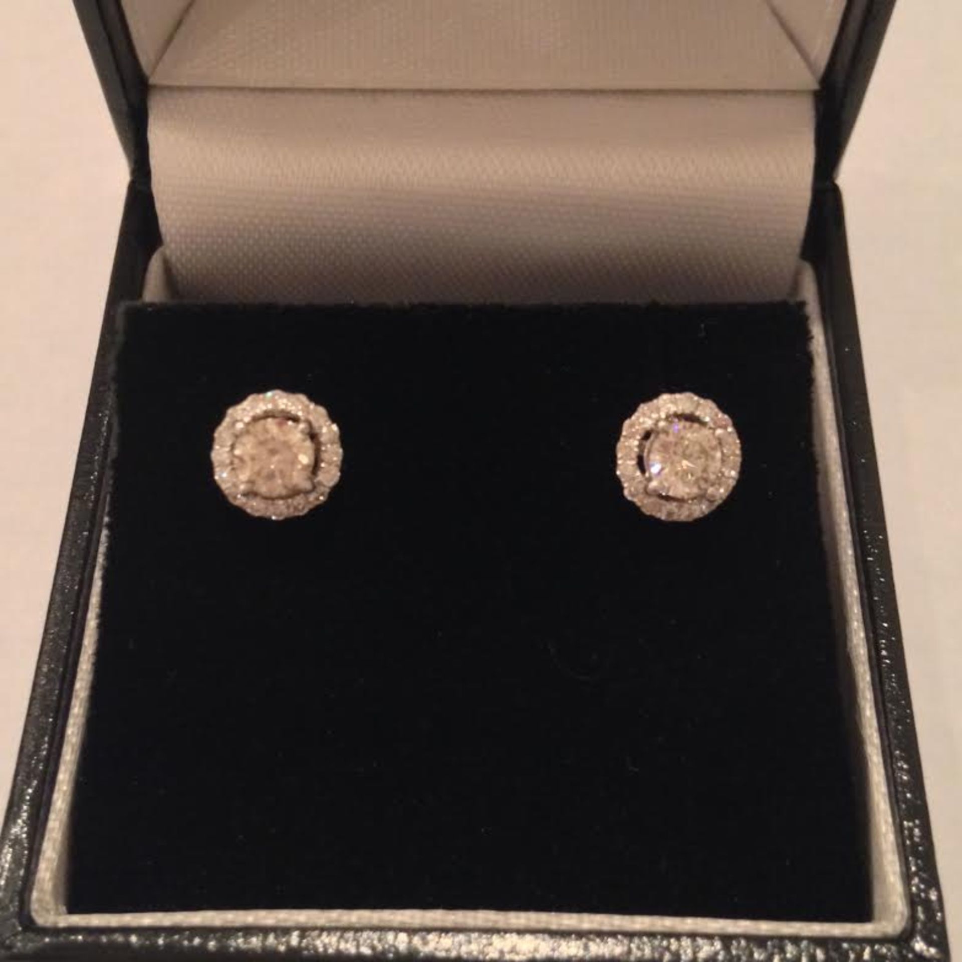 Beautiful 18ct gold diamond set stud style earrings each set with a russian cut diamond in the centr