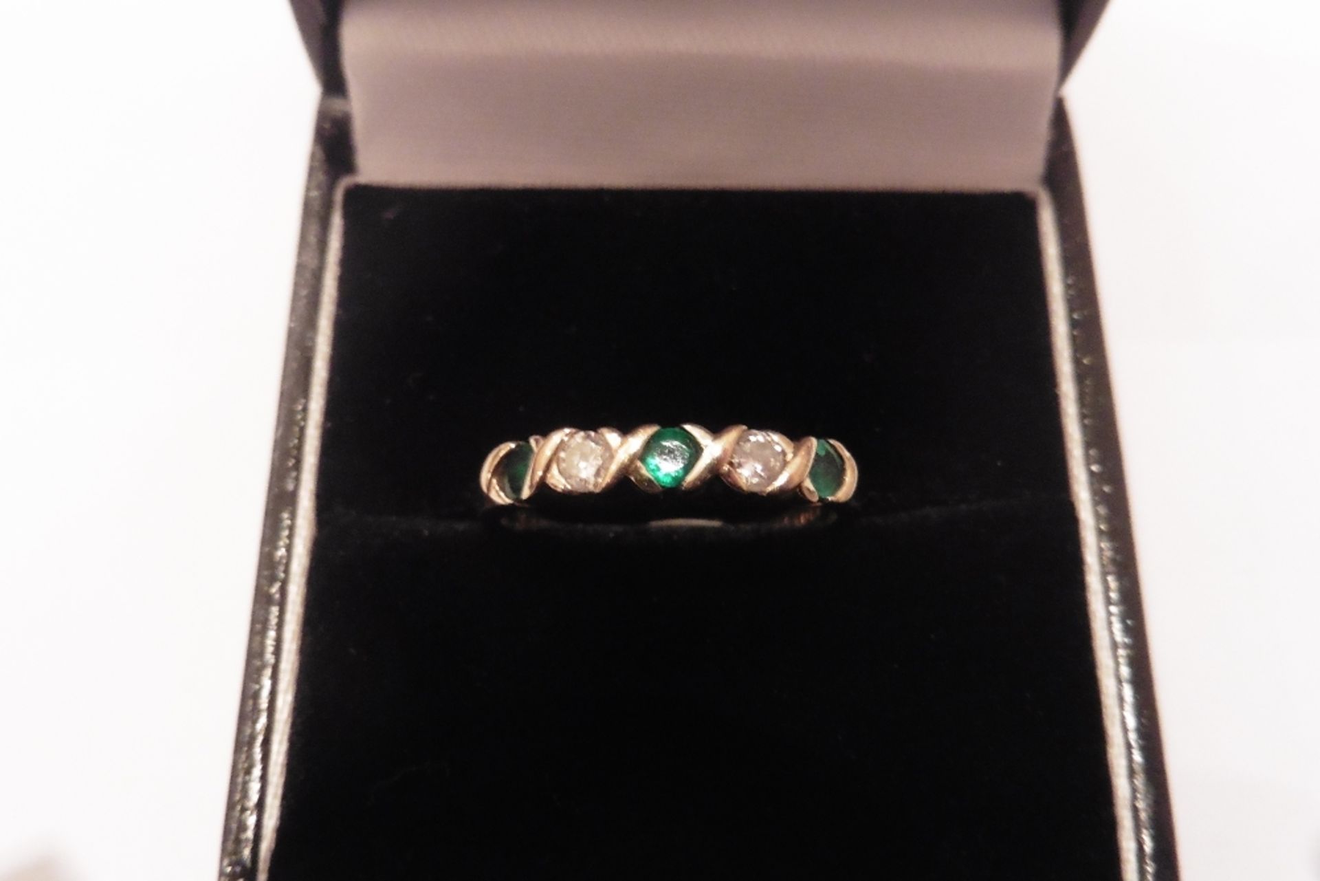Pre-owned 9ct yellow gold emerald and diamond eternity style ring set with 3 round cut emeralds and