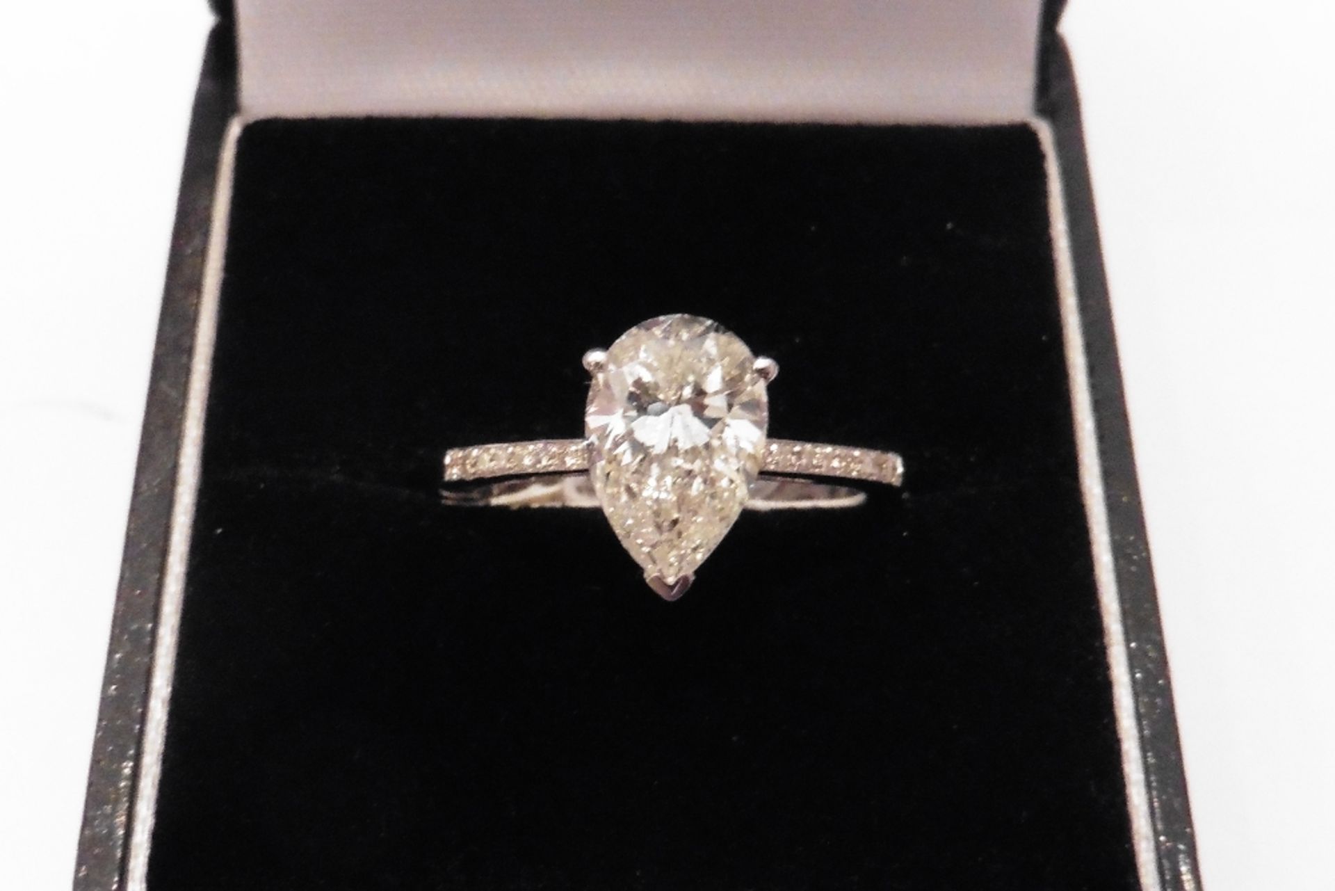 Tiffany set diamond solitaire ring hosting a beautiful pear shaped diamond weighing 2.06ct.  I colou