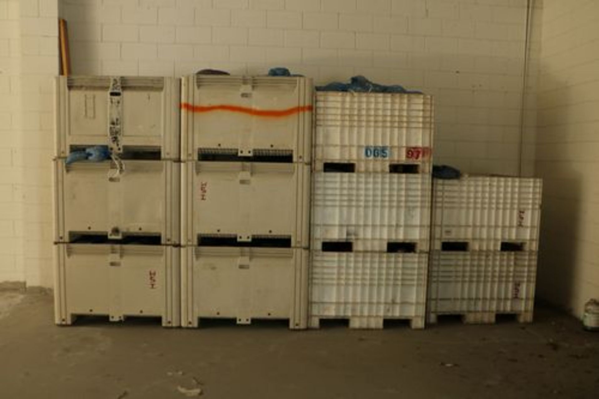 11 Storage Bins filled with White Porous Biologic Filter Media in Mesh Bags.