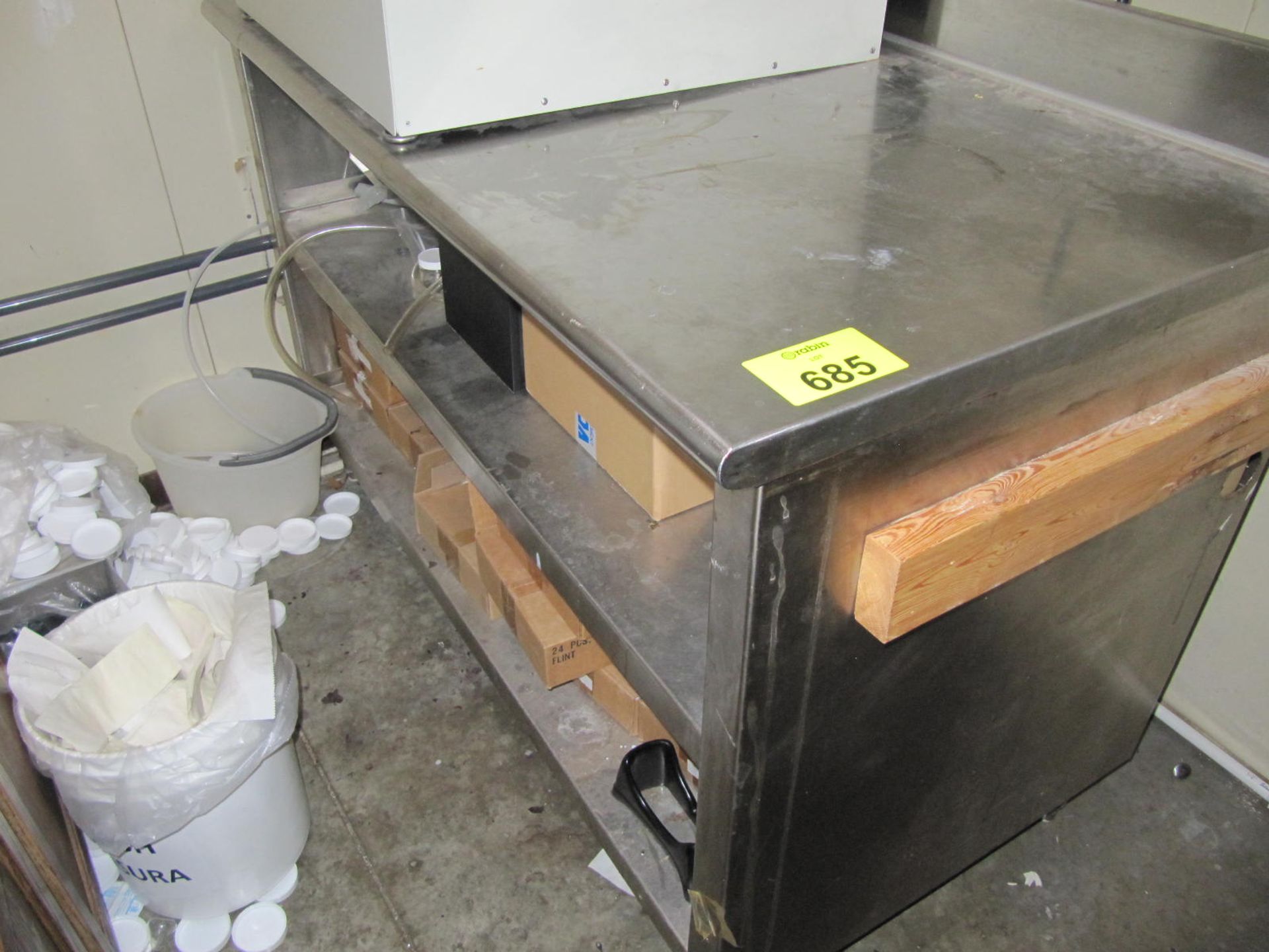 Stainless work table, 57" x 30" x 38" tall with (2) lower shelves|Bidding is subject to breaking the