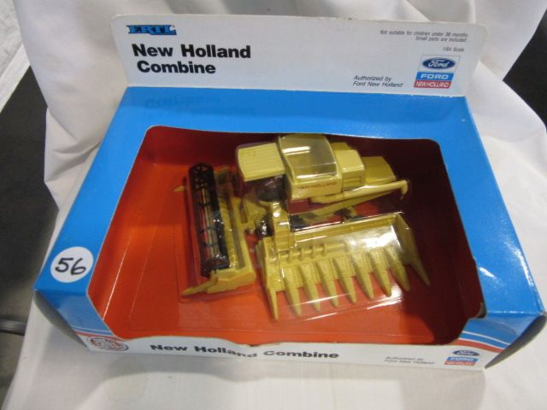 Ertl New Holland Combine w/Corn & Grain Heads, NIB, 1:64 Scale