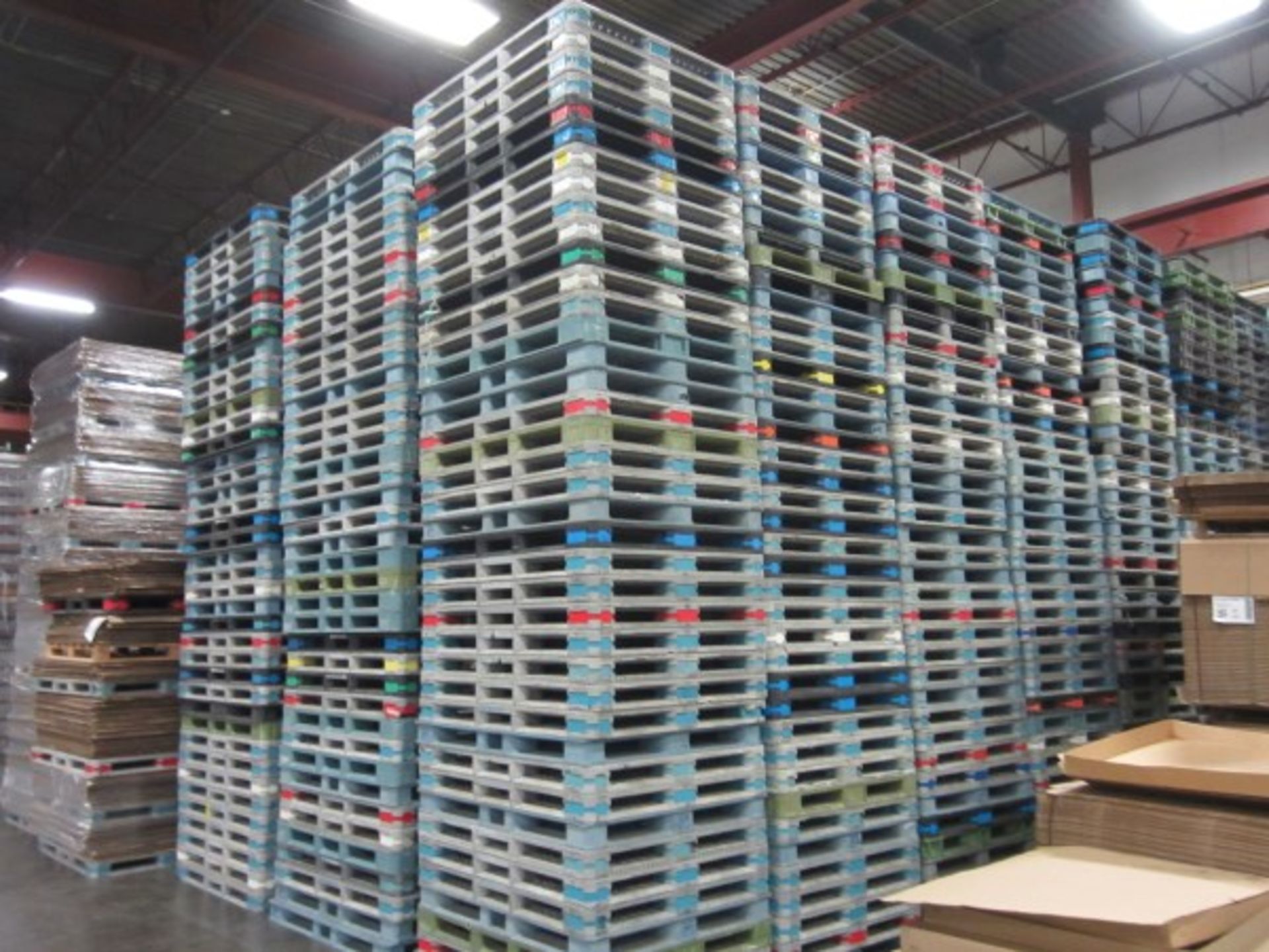 STACK OF 40 PLASTIC PALLETS