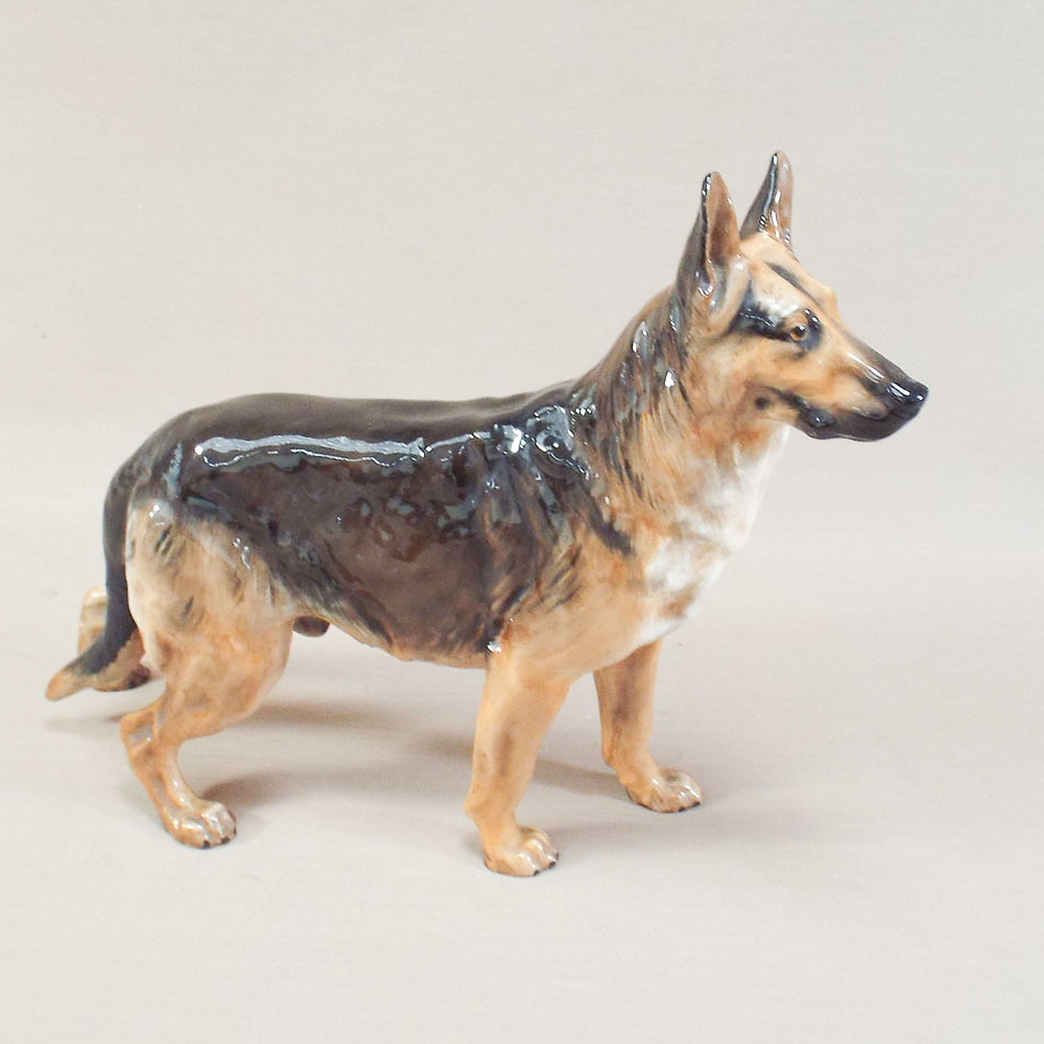 Royal Doulton German Shepherd dog standing in alert stance (tail restored)