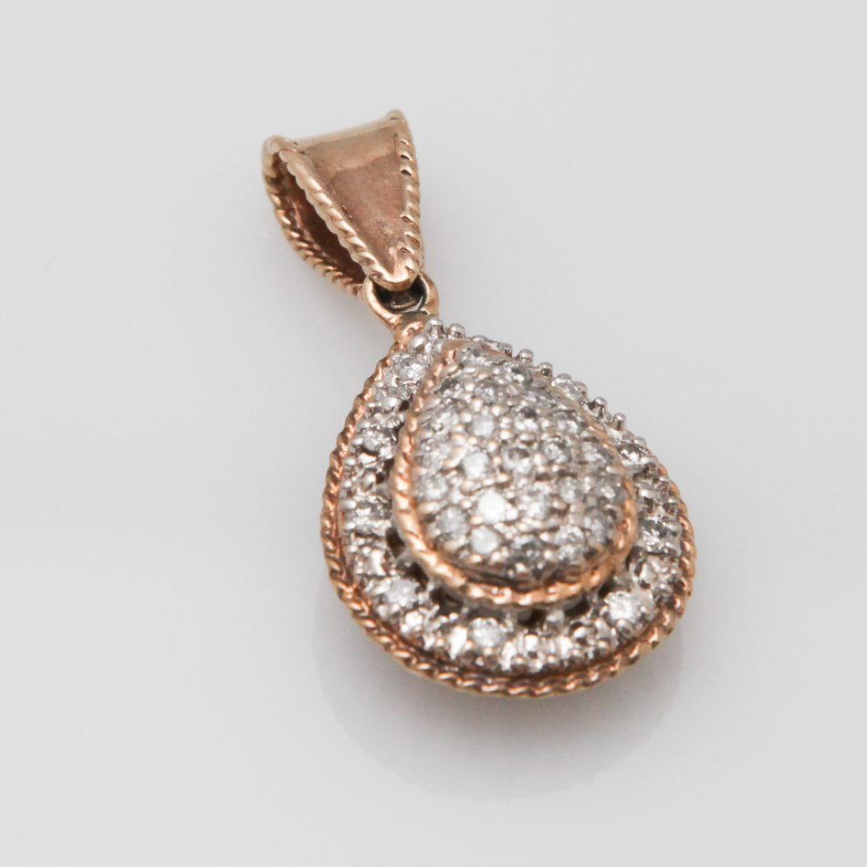 9 carat gold teardrop shaped diamond set pendant