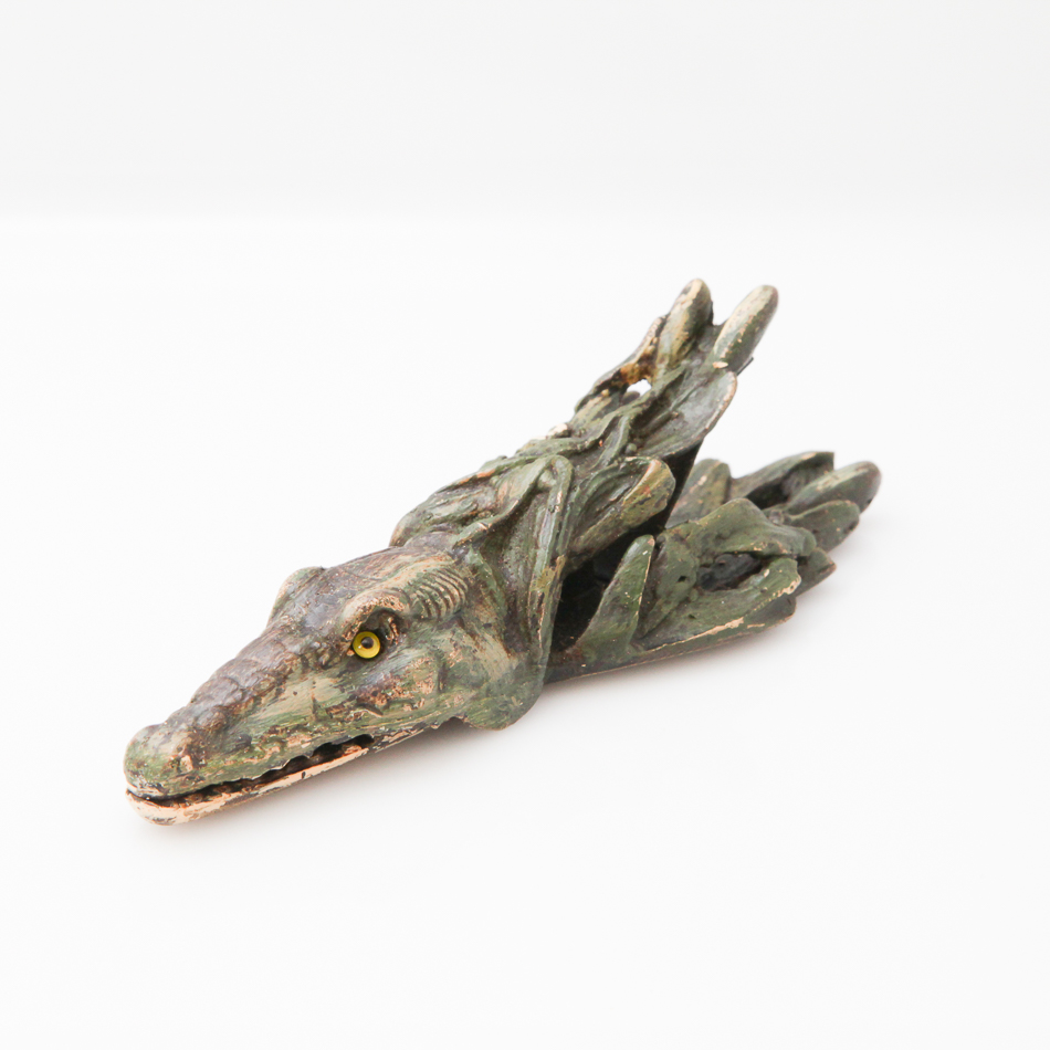 Cold painted bronze paper clip in the form of alligator with inset yellow glass eyes, 14 cm long