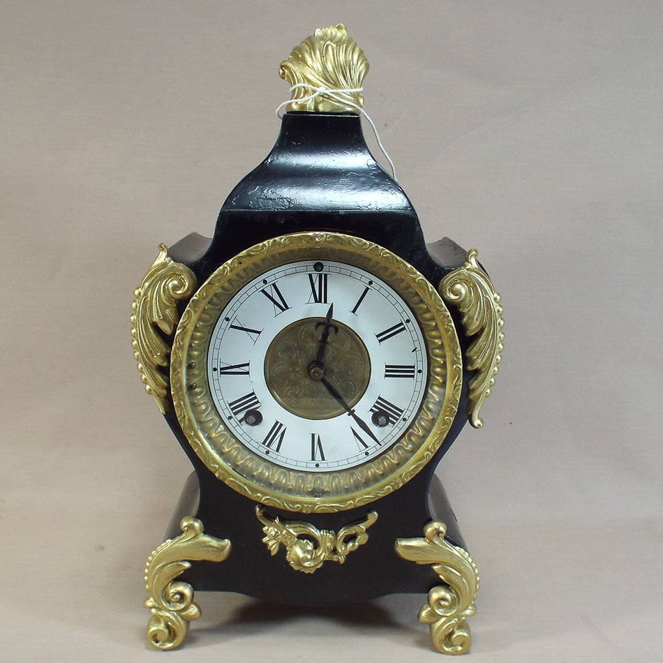 French striking mantel clock in gilt mounted black metal case