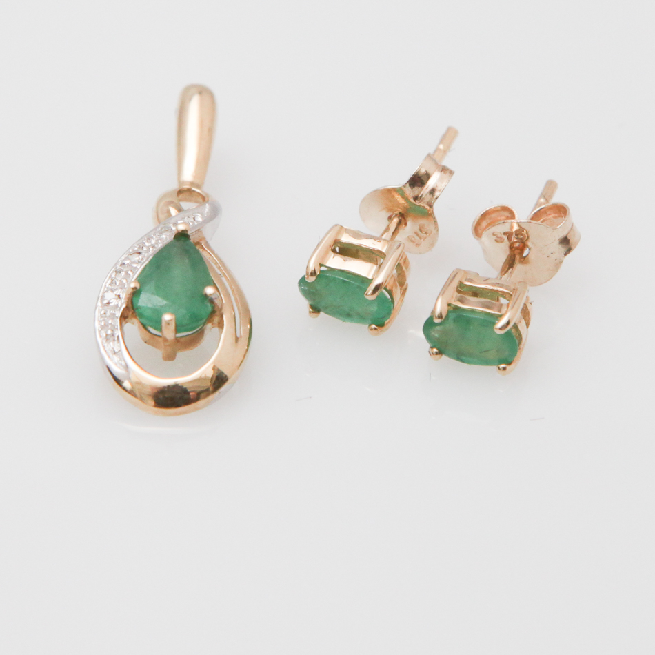 Pair of 9 carat gold oval emerald ear studs and a companion pendant set with diamonds